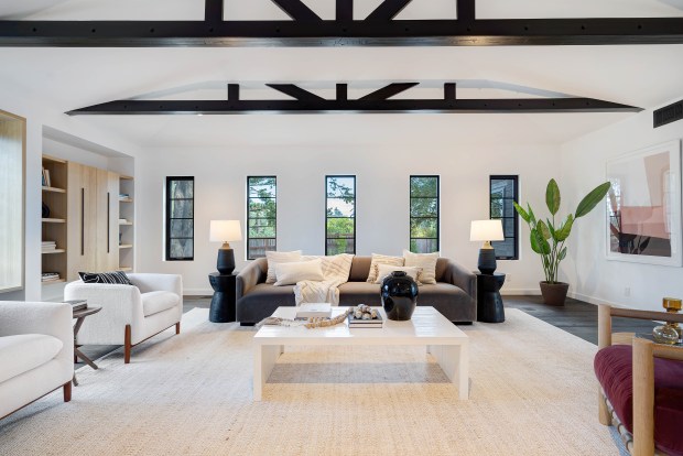 Living room with exposed beams.