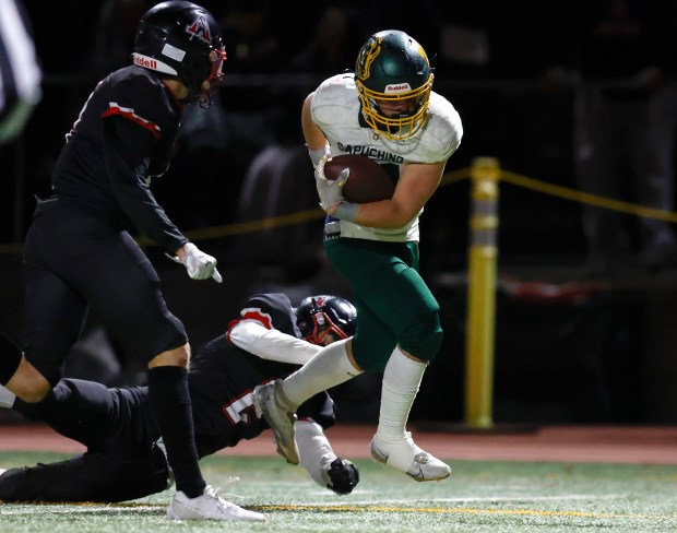 Capuchino's Lucas Zayac (21) scores a touchdown against Aragon's Marcus Gosch (2) in the third quarter at Aragon High School in San Mateo, Calif., on Thursday, Oct. 26, 2023. (Nhat V. Meyer/Bay Area News Group)