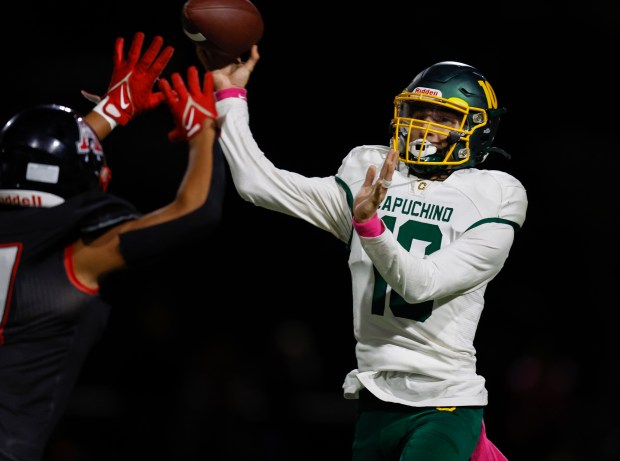 Capuchino starting quarterback Brandon Arceo (10) throws under pressure against Aragon's Kevin Wright (17) in the second quarter at Aragon High School in San Mateo, Calif., on Thursday, Oct. 26, 2023. (Nhat V. Meyer/Bay Area News Group)