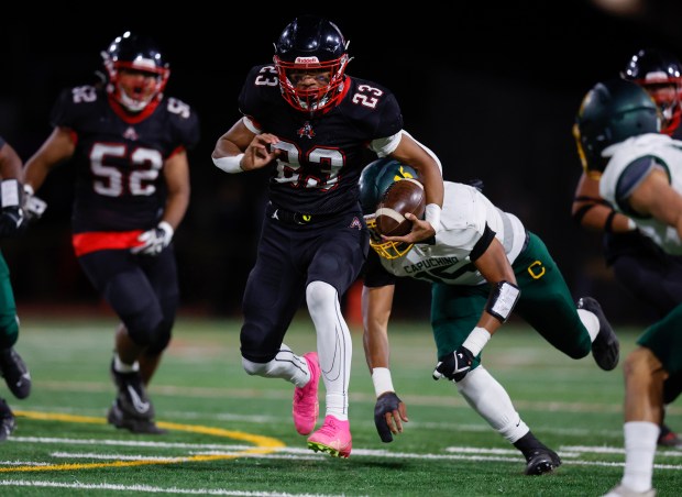 Aragon's Ivanhoe Nisa (23) runs against Capuchino's Mailau Ahohako (15) in the first quarter at Aragon High School in San Mateo, Calif., on Thursday, Oct. 26, 2023. (Nhat V. Meyer/Bay Area News Group)