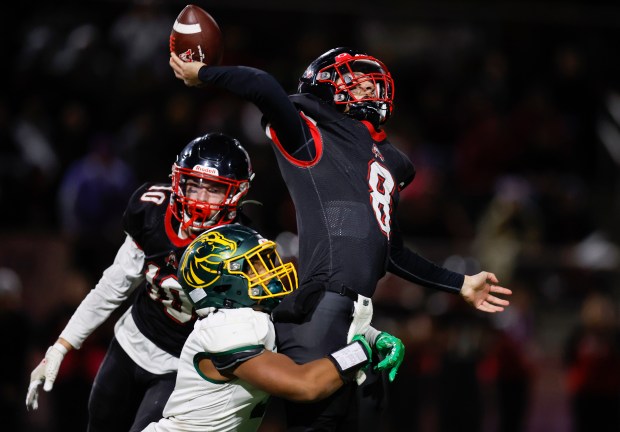 Aragon starting quarterback Sean Hickey (8) is hit as he throws by Capuchino's Chancellor Hernando (9) in the fourth quarter at Aragon High School in San Mateo, Calif., on Thursday, Oct. 26, 2023. (Nhat V. Meyer/Bay Area News Group)
