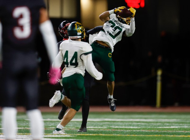 Capuchino's Sebastian Conclara (20) intercepts the ball on a pass intended for Aragon's Conor Reidy (9) late in the fourth quarter at Aragon High School in San Mateo, Calif., on Thursday, Oct. 26, 2023. (Nhat V. Meyer/Bay Area News Group)