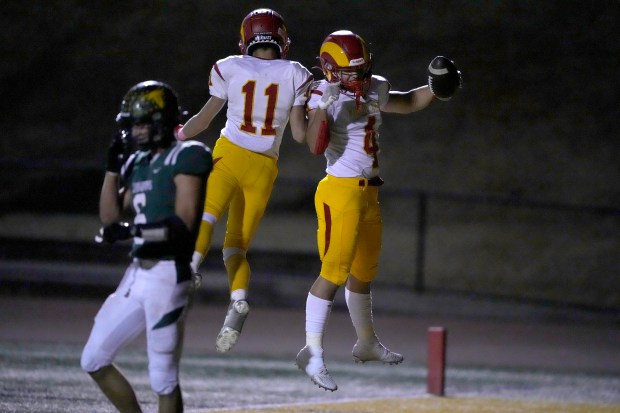 Willow Glen's Spencer Bartlinski (4) celebrates with Weber Maisel (11) after scoring a touchdown passed against Leigh in the first half in San Jose, Calif., on Friday, October 13, 2023. Tony Avelar for the Bay Area News Group