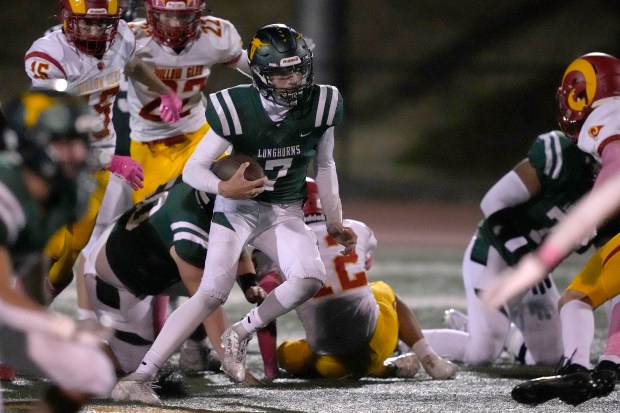 Leigh quarterback Tyler J. Donaldson (7) scrambles against Willow Glen in the second half in San Jose, Calif., on Friday, October 13, 2023. Leigh won 17-7. Tony Avelar for the Bay Area News Group