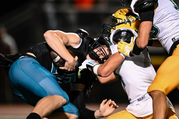 Christopher's Jaxen Robinson (20) is sacked by Live Oak defense during the 1st half of the Live Oak vs Christopher BVAL high school football game at Christopher High School in Gilroy, Calif., on Friday, Nov. 3, 2023. (Thien-An Truong for Bay Area News Group)