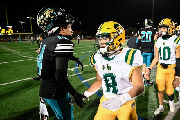 Live Oak's Josh Gagni (8) greets Christopher players after winning the Live Oak vs Christopher BVAL high school football game at Christopher High School in Gilroy, Calif., on Friday, Nov. 3, 2023. Live Oak defeats Christopher 28-24 to become the 2023 BVAL Mt. Hamilton Division Champions. (Thien-An Truong for Bay Area News Group)