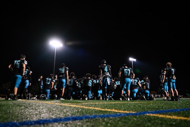 Christopher players stand on the field for a team meeting after losing the Live Oak vs Christopher BVAL high school football game at Christopher High School in Gilroy, Calif., on Friday, Nov. 3, 2023. Live Oak defeats Christopher 28-24 to become the 2023 BVAL Mt. Hamilton Division Champions. (Thien-An Truong for Bay Area News Group)