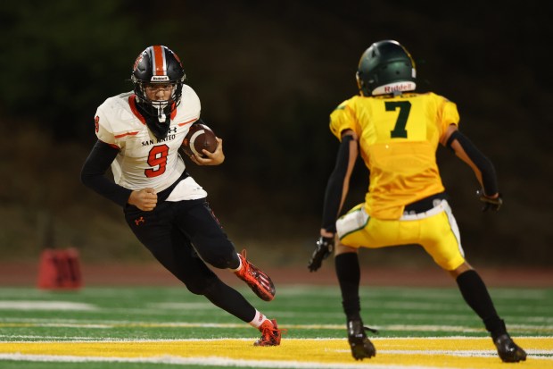San Mateo quarterback Cameron Palma #9 looks for yards on a keeper against Capuchino's David Sehorn #7, Friday, Oct. 13, 2023, in San Bruno, Calif. (Karl Mondon/Bay Area News Group)