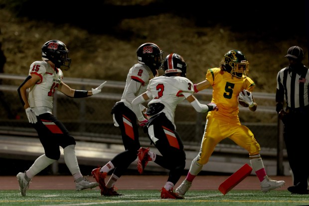 Charles Barfield #5 races down the sideline to the 1-yard line against San Mateo on a Capuchino touchdown drive in the 1st half, Friday, Oct. 13, 2023, in San Bruno, Calif. (Karl Mondon/Bay Area News Group)