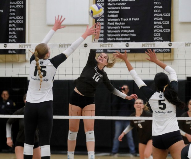 St. Francis' Sacha Touma spikes the ball as #10 Archbishop Mitty's Makenna Crosson #15 and Amiya Kuchibhotla #5 attempt to block during their NorCal Open Division volleyball match at Archbishop Mitty High School in San Jose, Calif., on Tuesday, Nov. 14, 2023. (Jane Tyska/Bay Area News Group)