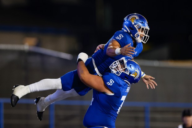 San Jose State's Kairee Robinson (32) jumps on San Jose State's Anthony Pardue (74) in celebration of scoring a touchdown against Colorado State in the second half at CEFCU Stadium in San Jose, Calif., on Saturday, Nov. 5, 2022. (Shae Hammond/Bay Area News Group)