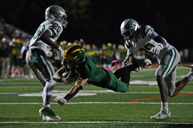 San Ramon Valley's Owen Scott (5) dives into the end zone to tie the game against De La Salle during the fourth quarter of their game at San Ramon Valley High School in Danville, Calif., on Friday, Oct. 13, 2023. De La Salle defeated San Ramon Valley in overtime 33-27. (Jose Carlos Fajardo/Bay Area News Group)