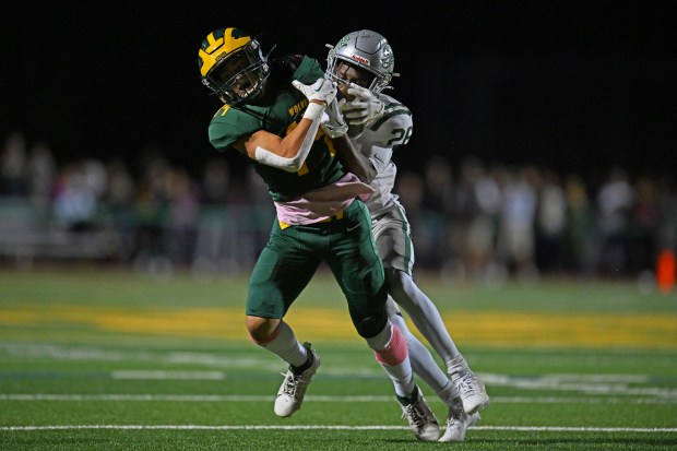 De La Salle's Anthony Dean (26) strips the ball away from San Ramon Valley's Evan Economos (14) for the interception during the third quarter of their game at San Ramon Valley High School in Danville, Calif., on Friday, Oct. 13, 2023. De La Salle defeated San Ramon Valley in overtime 33-27. (Jose Carlos Fajardo/Bay Area News Group)