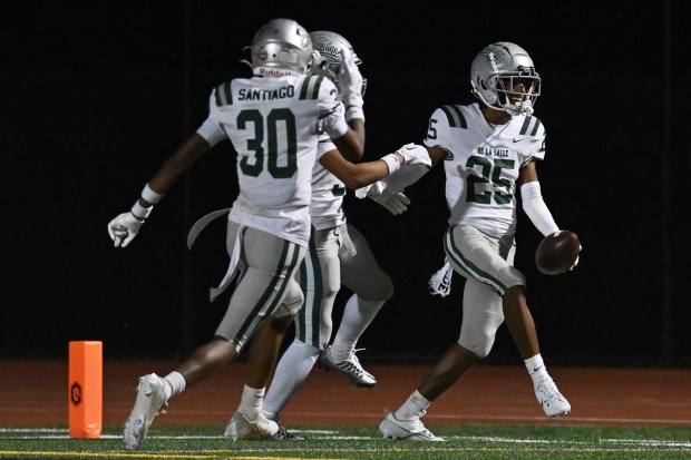 De La Salle's Jayden Nichols (25) is all smiles while scoring a touchdown after intercepting a deflected pass by San Ramon Valley in the fourth quarter of their game at San Ramon Valley High School in Danville, Calif., on Friday, Oct. 13, 2023. De La Salle defeated San Ramon Valley in overtime 33-27. (Jose Carlos Fajardo/Bay Area News Group)