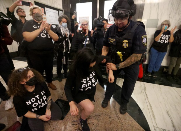 Federal Protective Service police officers arrest protesters after they refused to disperse at the Ronald V. Dellums Federal Building in downtown Oakland, Calif., on Monday, Nov. 13, 2023. Jewish-led groups called for a ceasefire in Gaza. (Jane Tyska/Bay Area News Group)