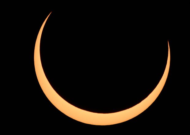 The Moon crosses in front of the Sun over Albuquerque, New Mexico, during an annular eclipse on October 14, 2023. (Photo by Patrick T. Fallon / AFP) (Photo by PATRICK T. FALLON/AFP via Getty Images)