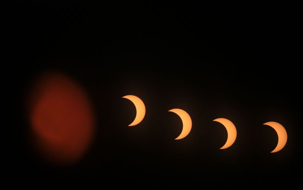This multi-exposure image shows the annular solar eclipse as seen from the Pierre & Marie Curie School in Managua on October 14, 2023. (Photo by OSWALDO RIVAS / AFP) (Photo by OSWALDO RIVAS/AFP via Getty Images)
