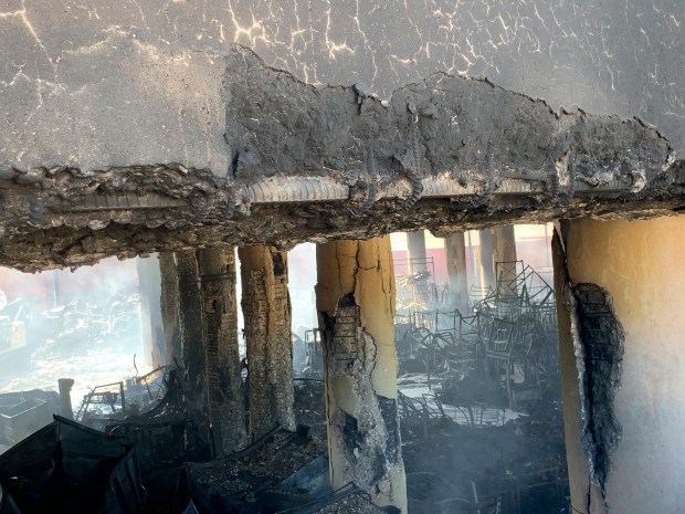 This photo provided by the California Department of Transportation shows the damage of columns from a fire under Interstate 10 that severely damaged the overpass in an industrial zone near downtown Los Angeles on Saturday, Nov. 11, 2023. Authorities say firefighters have mostly extinguished a large blaze that burned trailers, cars and other things in storage lots beneath a major highway near downtown Los Angeles, forcing the temporary closure of the roadway. (Caltrans District 7 via AP)