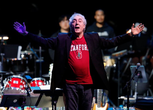 Stanford Symphony Orchestra conductor Paul Phillips acknowledges the crowd as they perform with Bobby Weir & Wolf Bros featuring The Wolfpack at the Frost Amphitheater in Palo Alto, Calif., on Sunday, Oct. 29, 2023. (Jane Tyska/Bay Area News Group)