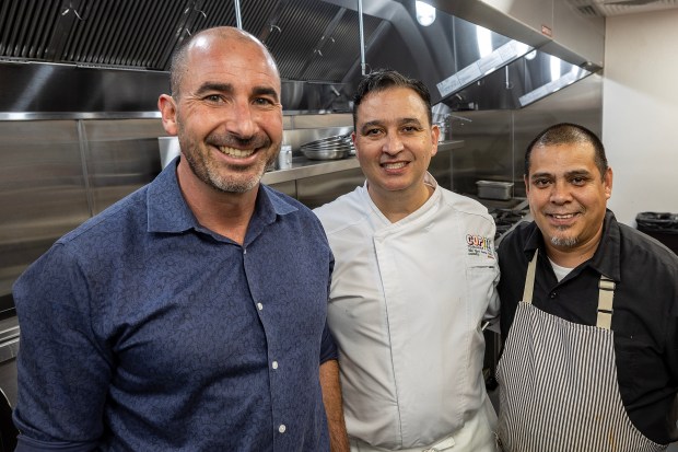 David Cirigliano, left, the service manager at Copita in San Jose's Willow Glen, pauses for a moment with Chef Azaria from Mexico City and sous chef Osvaldo, as they prepare on Thursday, Oct. 26, 2023, for their next week's highly-anticipated opening. (Karl Mondon/Bay Area News Group)