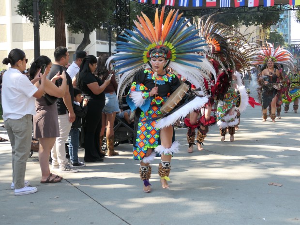 Members of the Calpulli Tonalehqueh, aztec dance group perform at the Heritage Festival in the Plaza de Cesar Chavez Park in San Jose, Calif.. on Saturday, Sep 16, 2023. (Rashel Naranjo Arellano/Mosaic Vision Staff)