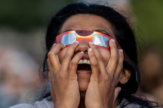 A spectator gasps as clouds part revealing the annular eclipse during a sky viewing event, Saturday, Oct. 14, 2023, on the intramural fields at Stanford University. (Karl Mondon/Bay Area News Group)
