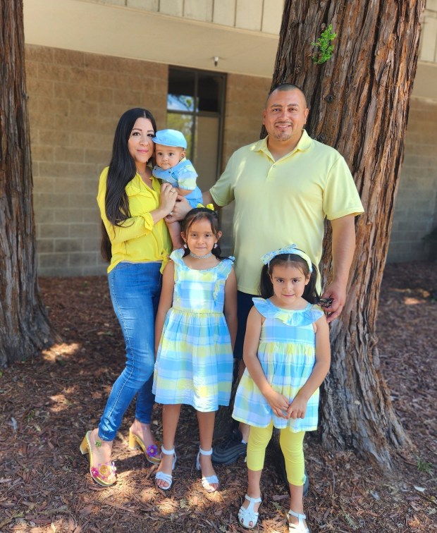 Edgar and Suleyma Andrade of Morgan Hill, pictured here with their three children, have applied to build a two-story, 8,400- square foot house in Coyote Valley. The Santa Clara Valley Open Space Authority says the home would wreck the character of the farmlands and open space preserves in the area and on Sept. 14, 2023 began a process to force the Andrades to sell the property under eminent domain. (Photo: Edgar Andrade)