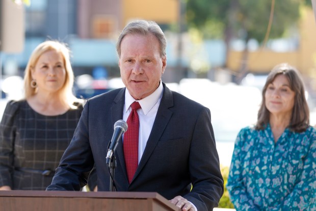 Cindy Chavez, mayoral candidate and Santa Clara County Supervisor, and Geralyn Maul-Vasquez, whose son died from an accidental fentanyl overdose in 2020, stand behind Senator Dave Cortese as he talks about introducing legislation to prevent fentanyl youth poisoning deaths during a press conference behind the Santa Clara County building in San Jose, Calif., on Monday, Nov. 7, 2022. (Shae Hammond/Bay Area News Group)