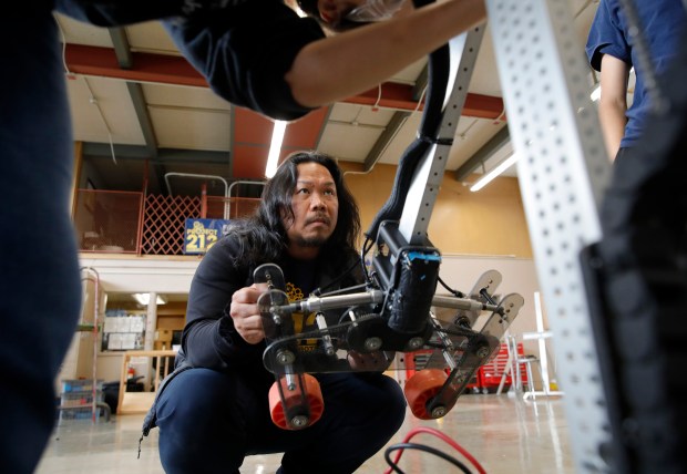 Teacher and advisor Joseph Alvarico works with students in the robotics program at Ygnacio Valley High School in Concord, Calif., on Wednesday, Oct. 25, 2023. Alvarico is originally from the Philippines and just won a California Teacher of the Year award. (Jane Tyska/Bay Area News Group)