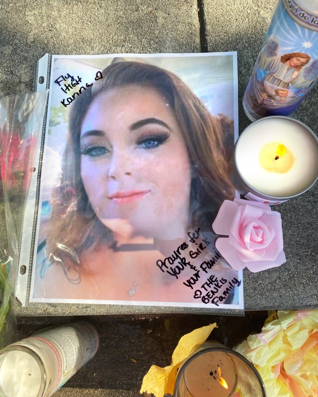 A photo of Karina Castro, 25, who was beheaded on the street in front of her San Carlos apartment on Thursday, Sept. 8, is placed at a makeshift memorial where she died. Her estranged boyfriend is in custody. (Photo courtesy of Monica Camacho)