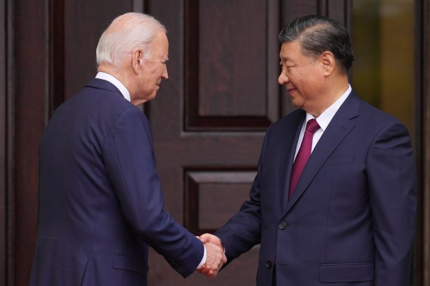 5President Joe Biden greets China's President President Xi Jinping at the Filoli Estate in Woodside, Calif., Wednesday, Nov, 15, 2023, on the sidelines of the Asia-Pacific Economic Cooperative conference. (Doug Mills/The New York Times via AP, Pool)